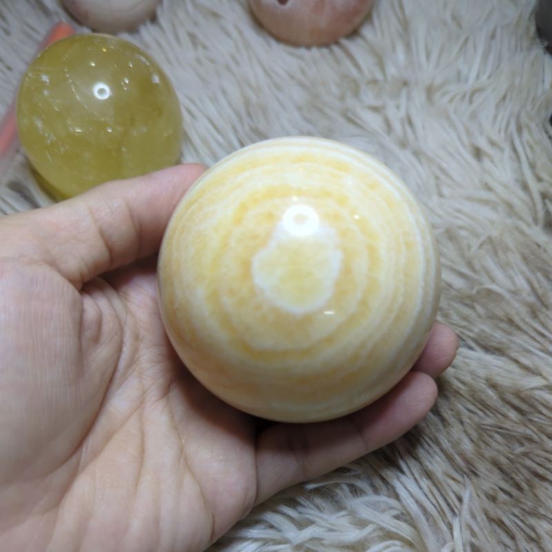 honey calcite and yellow banded calcite crystal sphere