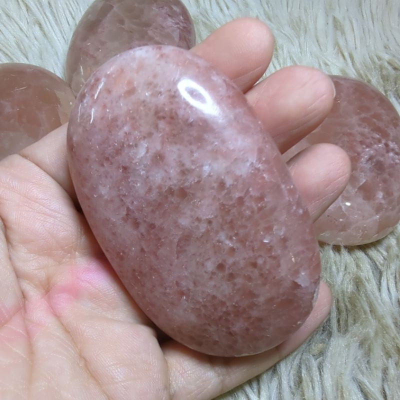 rose calcite palm stone