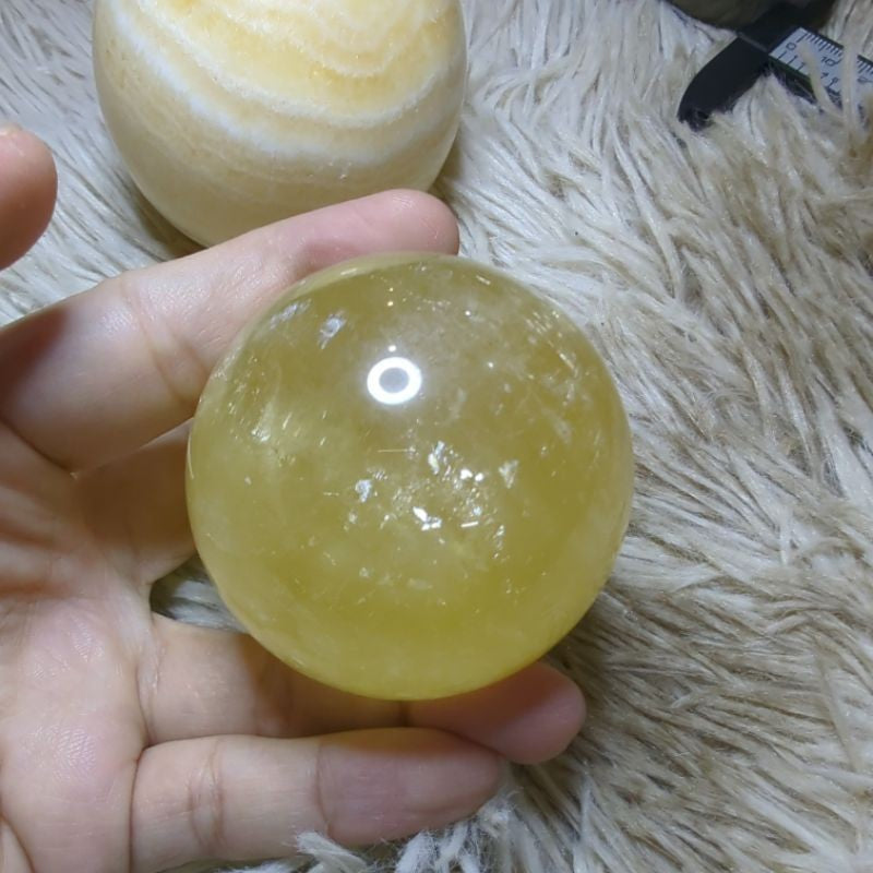 honey calcite and yellow banded calcite crystal sphere