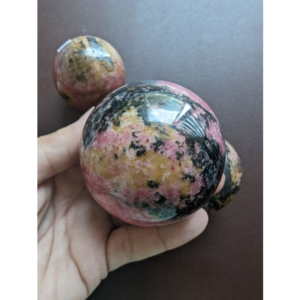 rhodonite sphere for love and emotional balance