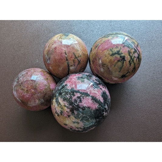 rhodonite sphere for love and emotional balance