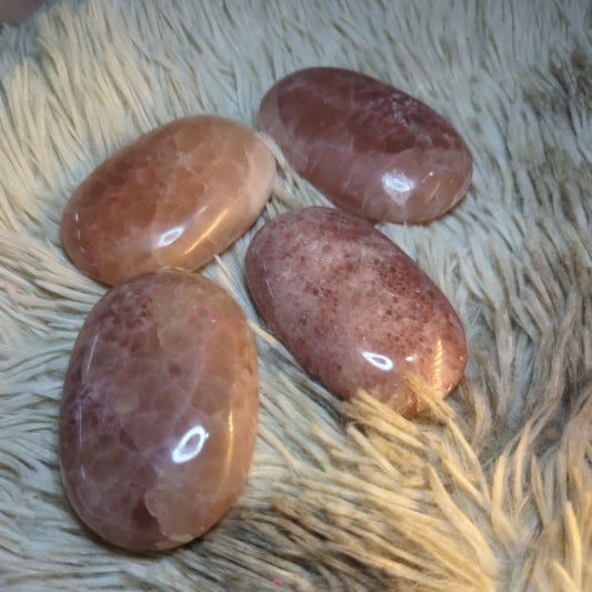 rose calcite palm stone