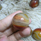 sardonyx palm stone and mini sphere