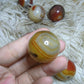 sardonyx palm stone and mini sphere