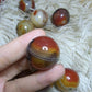 sardonyx palm stone and mini sphere