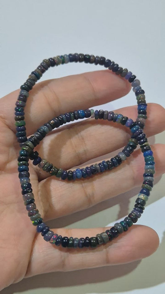 Ethiopian Welo Opal rondelle beads (blue/black) (price per piece)